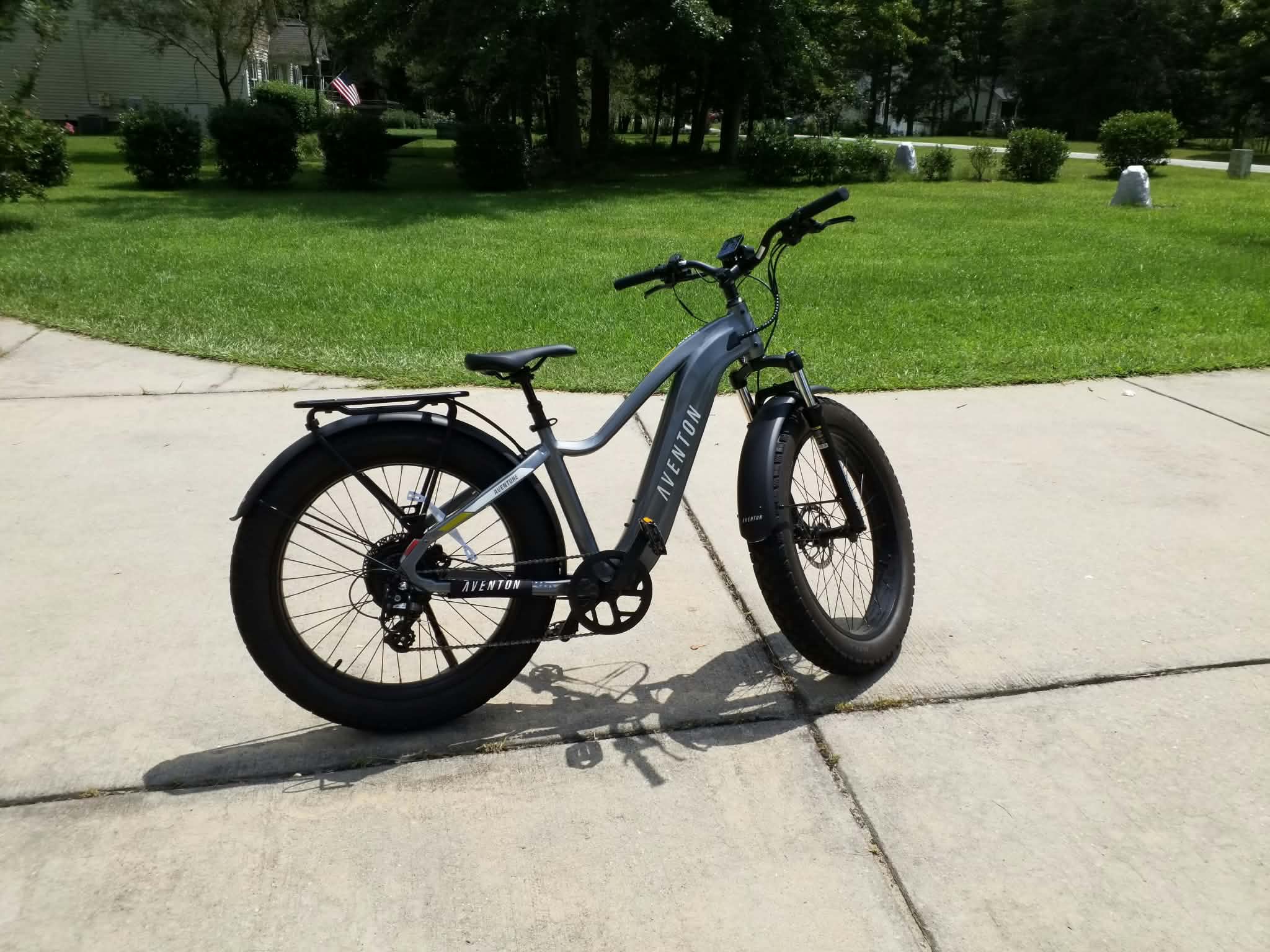 Gray Aventon e-bike with wide tires and a rear rack