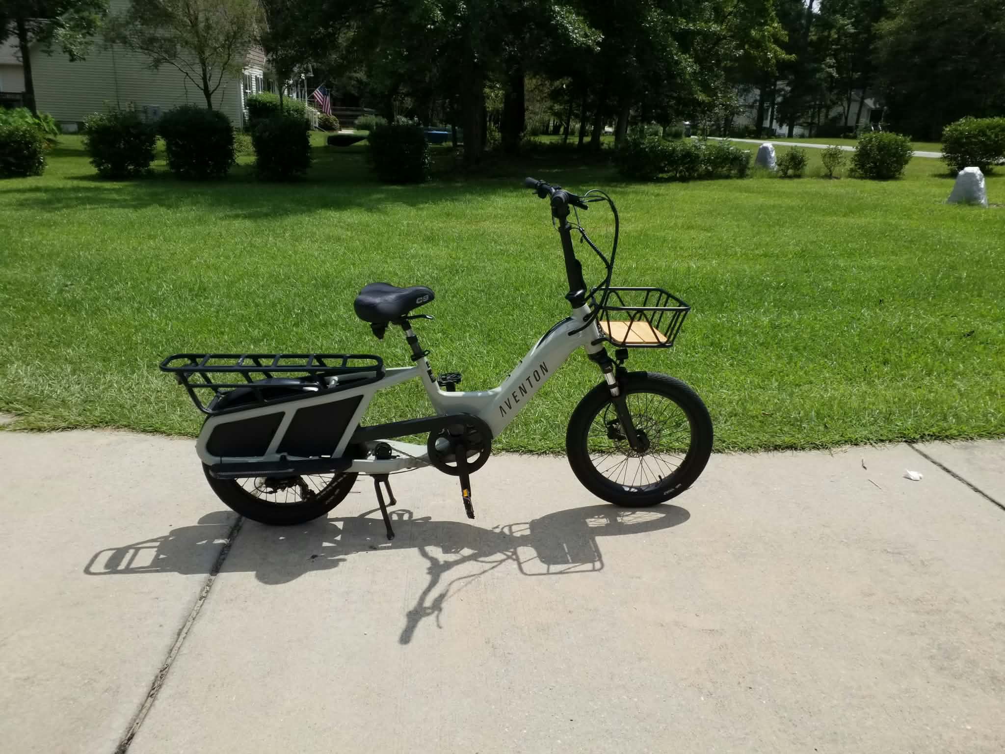 White Aventon cargo e-bike with front and rear racks
